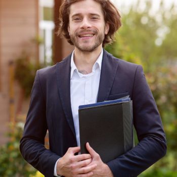 real-estate-agent-with-documents-Z4CHLJ4.jpg